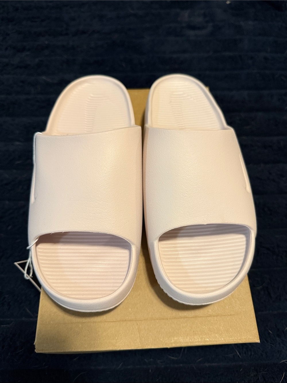 Nike Women’s Calm Slide Sandals in Light Pink
